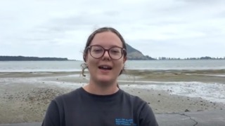 Student Jamie Lynds investigates sea lettuce in Tauranga Harbour.